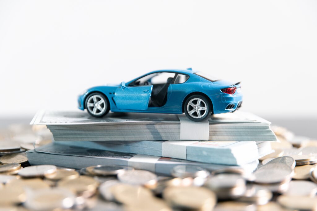 Toy car on top of cash | How to lease a car with bad credit