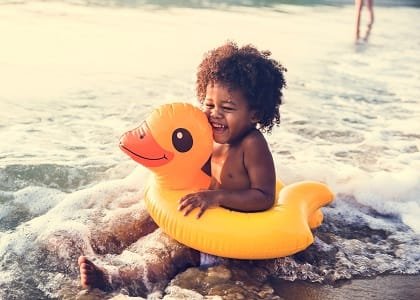 African,Little,Boy,Playing,At,The,Beach